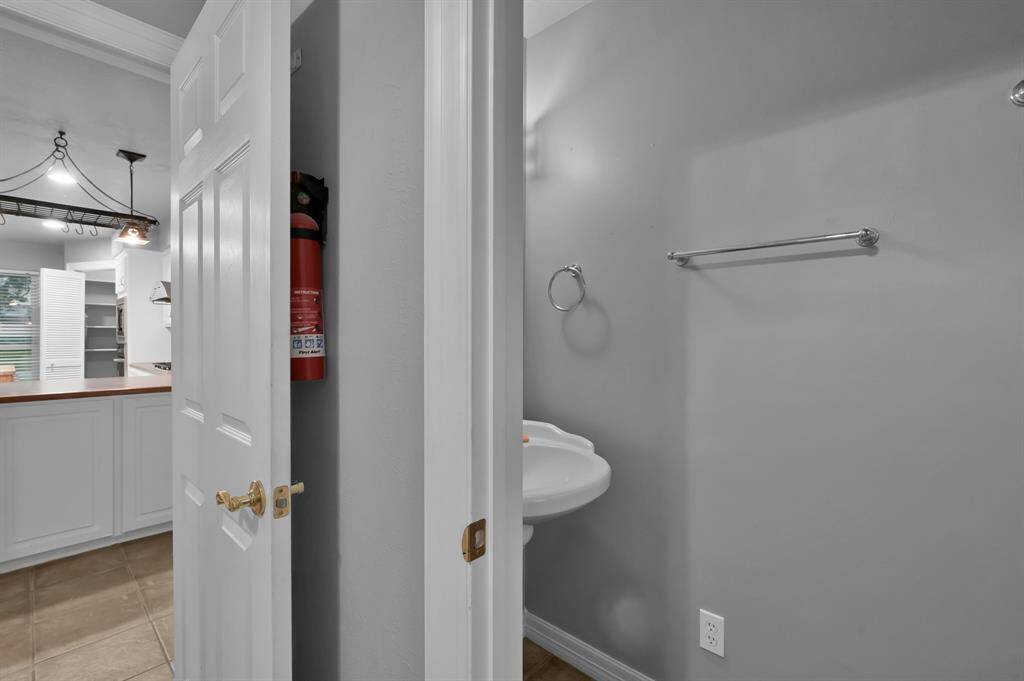 VIEW FROM LAUNDRY ROOM TO KITCHEN AND HALF BATH