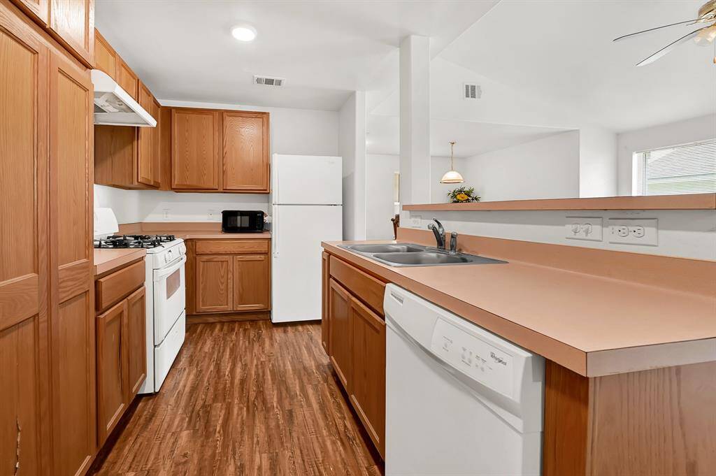 Kitchen opens up to the living and dining area.