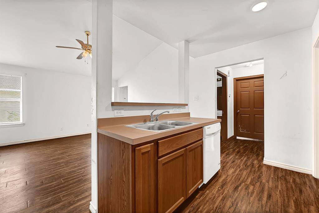 Kitchen opens up to the living and dining area.