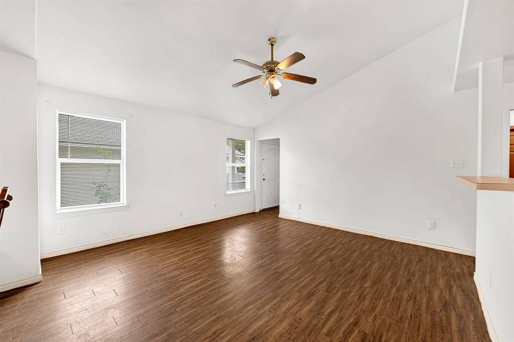 Living room area flowing into the kitchen and dining room.
