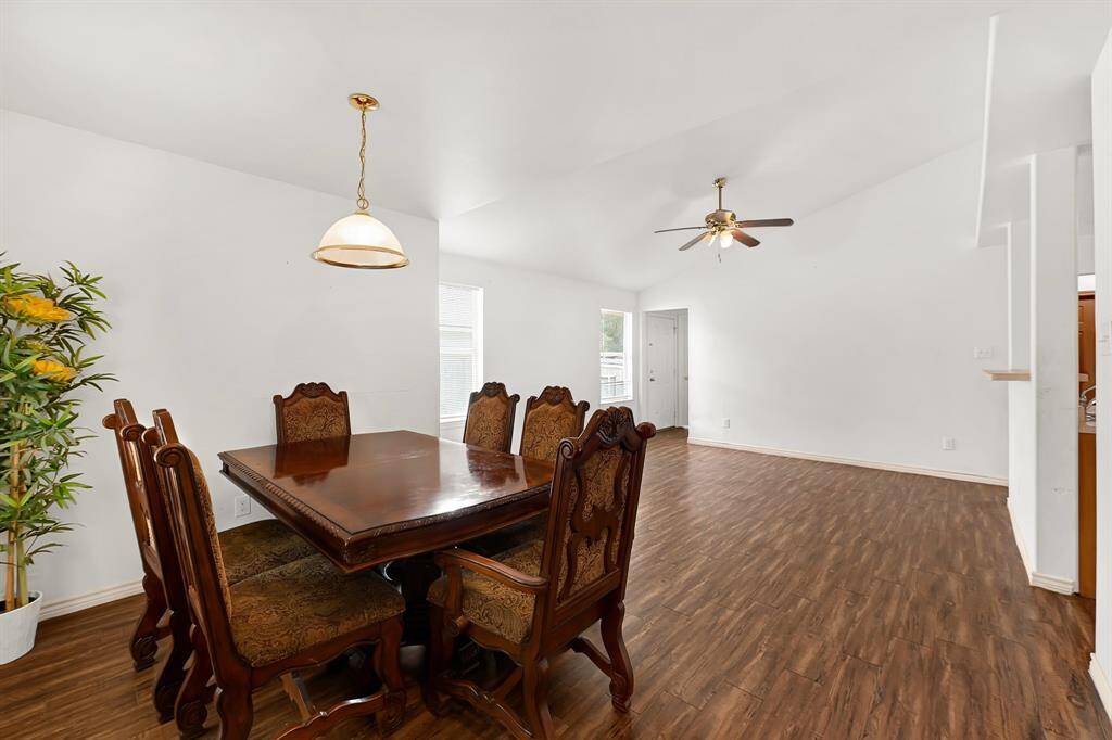 Dining area flowing into the living room and kitchen.