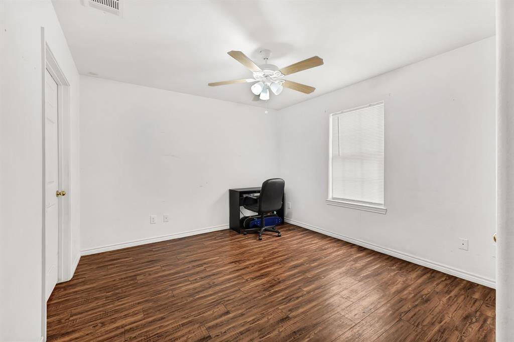 Primary bedroom located next to the dining area.