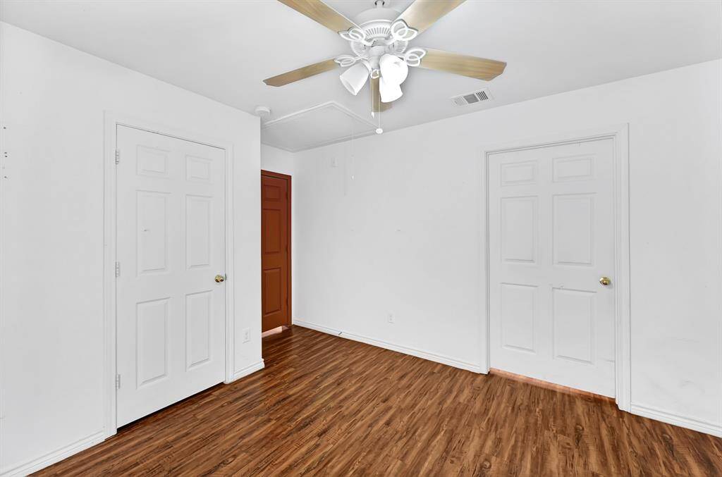 Primary bedroom located next to the dining area.