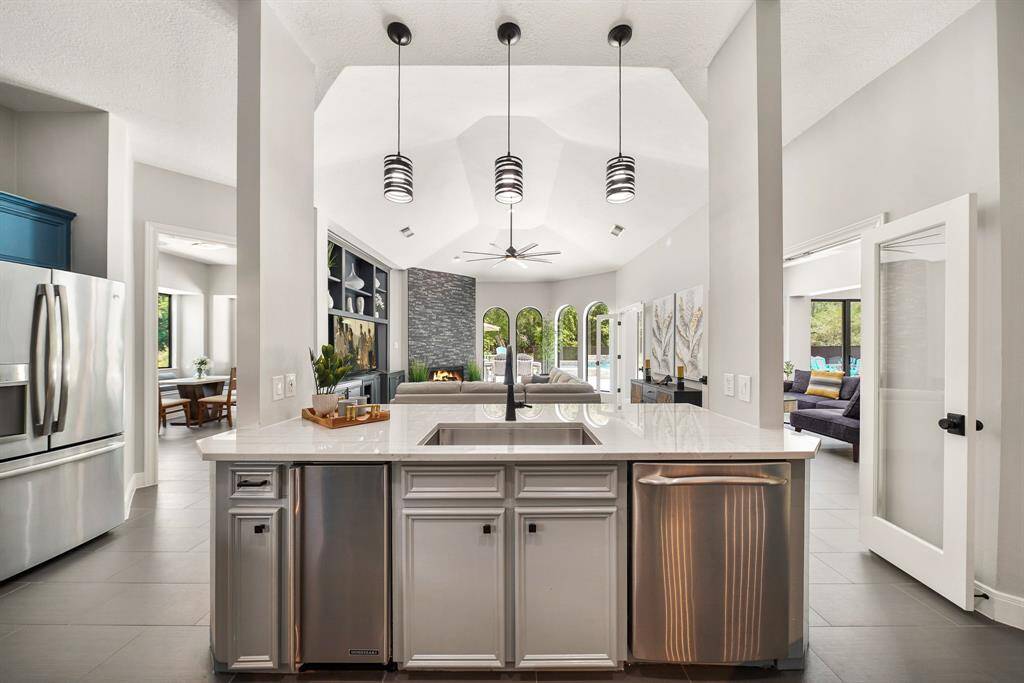 The Kitchen Island comes equipped with a stainless steel, single basin, undermount sink, built-in ice maker, and whisper quiet dishwasher. Notice how the home chef has direct sightlines to the entire main living space, making it easy to socialize while entertaining.