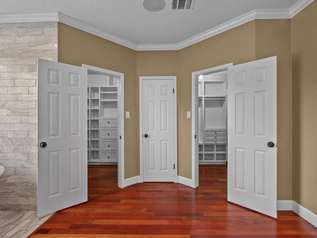 Primary Bathroom Suite to Primary Closets