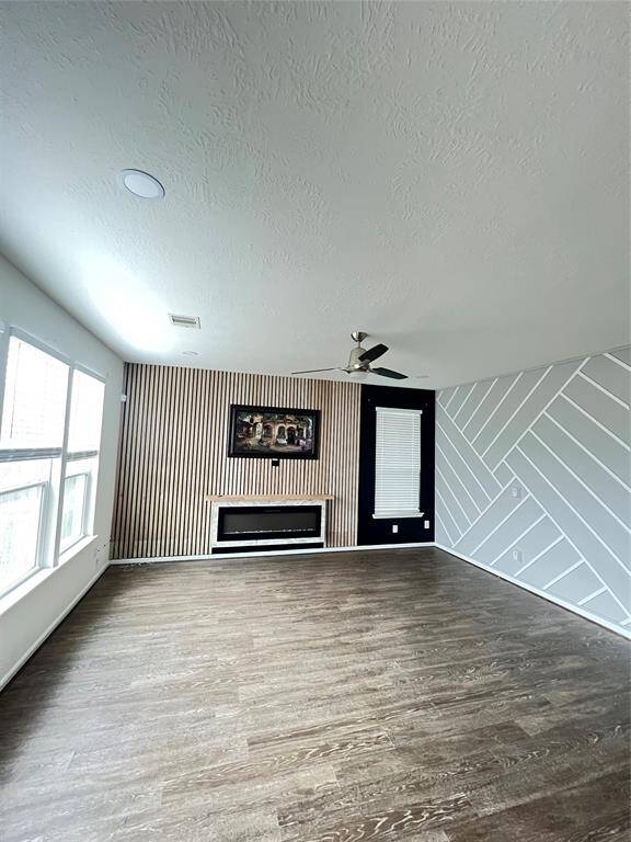 Stylish and inviting lounge featuring two eye-catching accent walls that add depth and personality to the space.