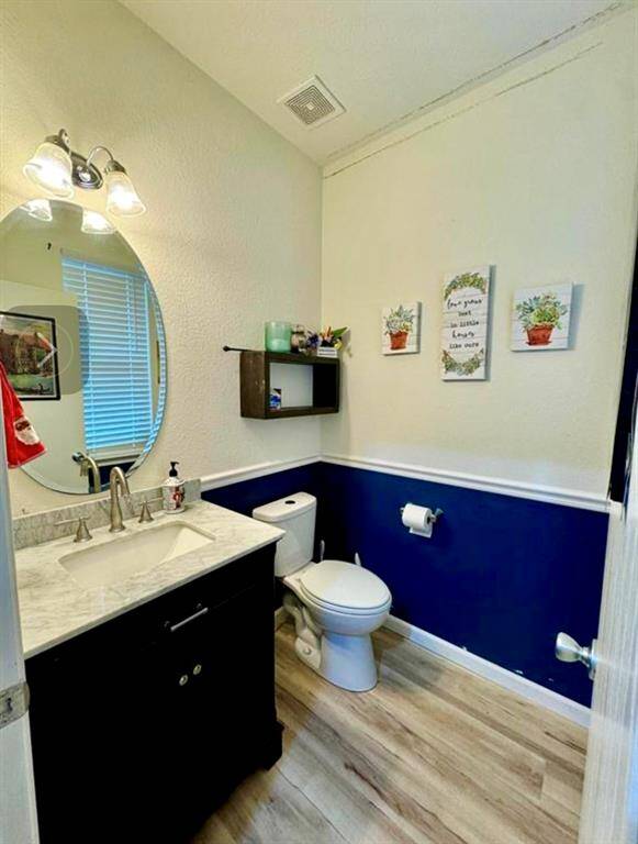 Modern half bath located on the first floor.