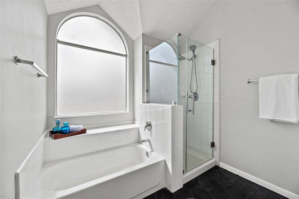 Tub in primary bathroom has been replaced.  Also, a new seamless shower added.