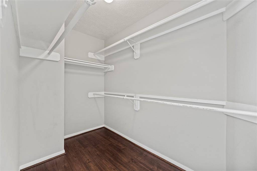 Walk-in closet in the primary bedroom.