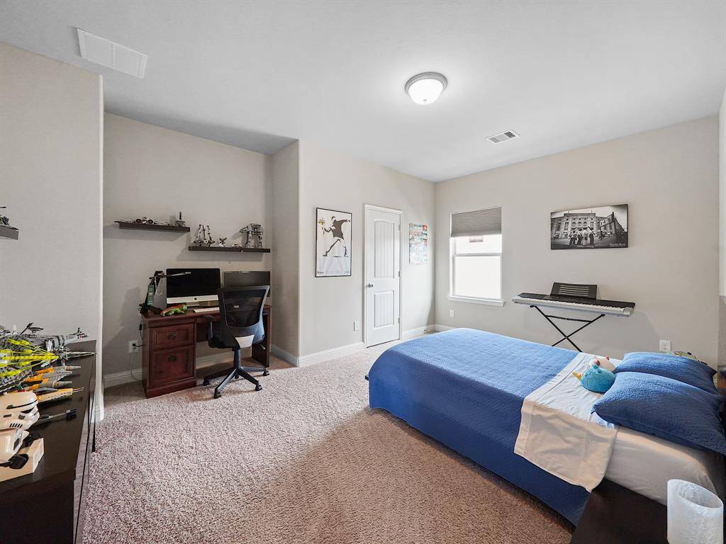 One of two bedrooms on the 2nd floor. Secondary bedrooms are generously sized.