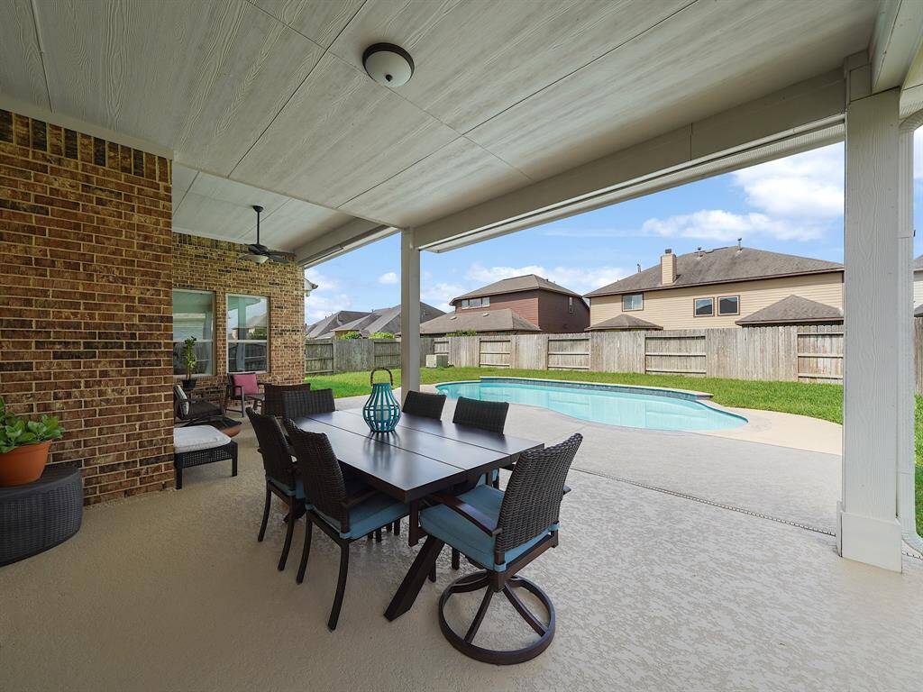 Retreat from the summer heat under the covered patio.