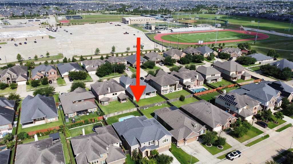 Aerial view from the front of the home. This view shows the walking trail you can use to get to school.