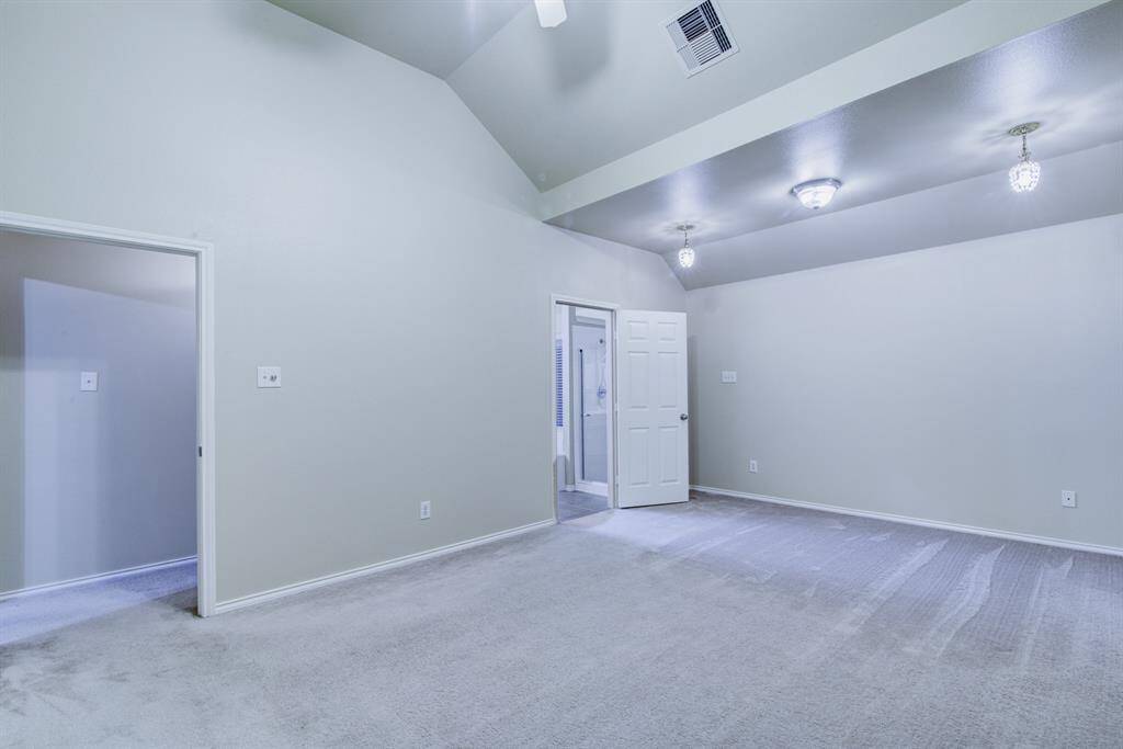 A private hall leads into the primary bedroom.