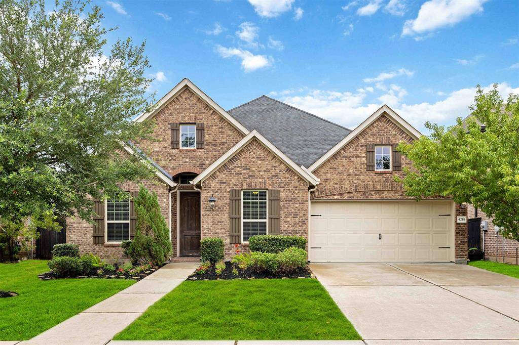 This home features  a classic brick façade that adds timeless appeal and lasting durability.