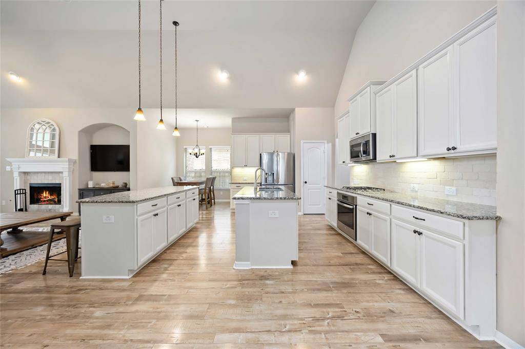 Kitchen offers tons of cabinets and storage spaces.
