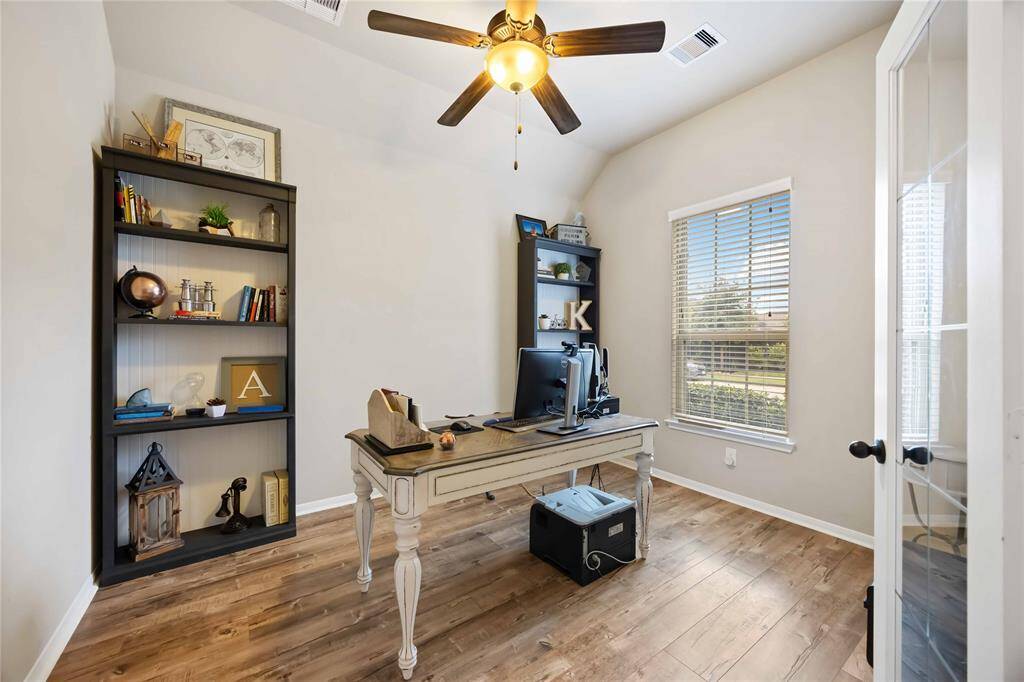 Private study features a large window that fills the space with natural light.