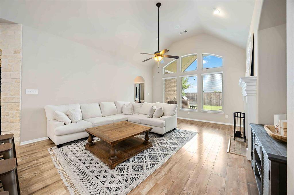 A stunning wall of windows that  fills the space with natural light while offering beautiful views of the backyard.