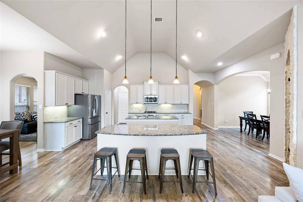 The kitchen has a breakfast bar offering additional seating for family & friends.