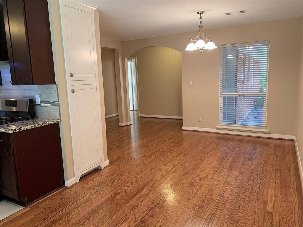 View of dining area looking toward the front entrance. Neutral colors!