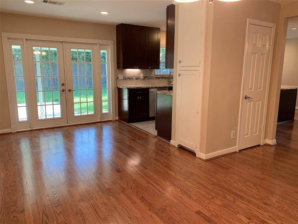 View of French doors. Pantry & Coat closet. Recessed lights.