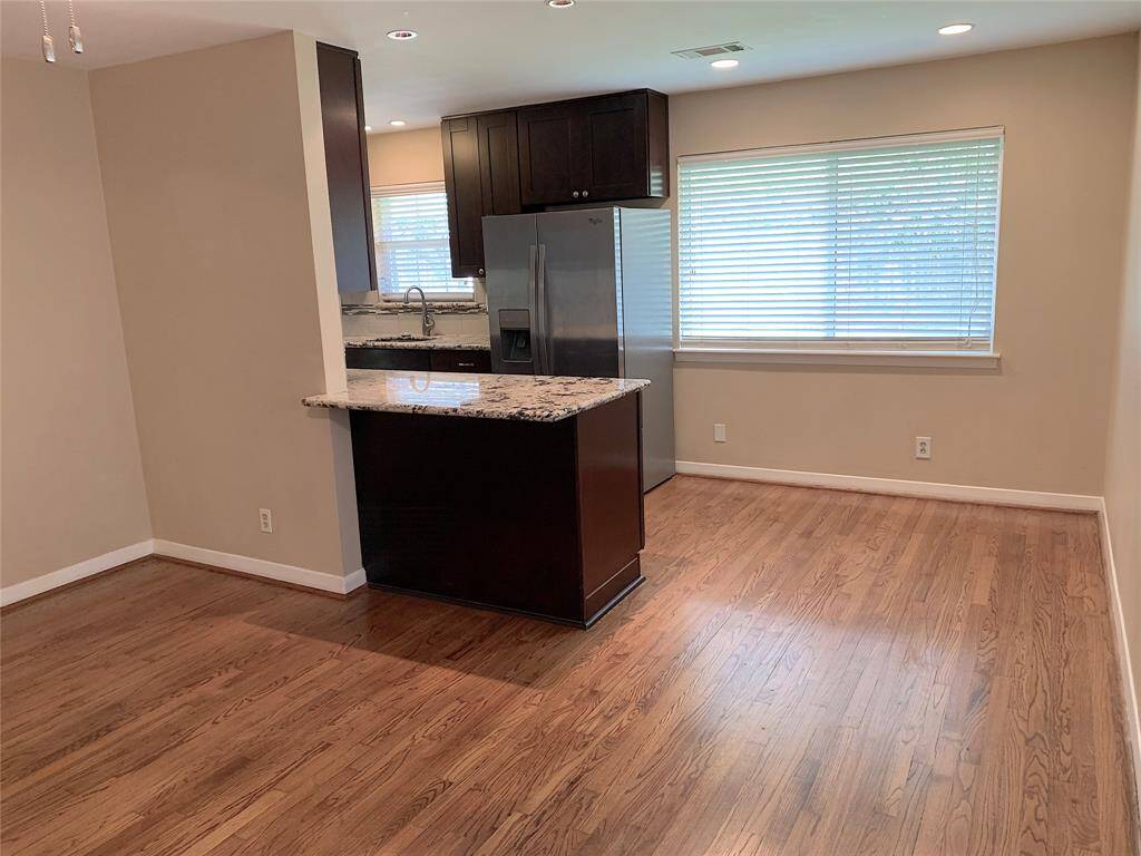 Recessed lights and lots of double-paned windows with 2 inch blinds.