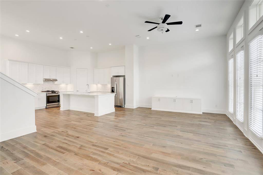 As you come up the stairs from the foyer, you'll see just how big the living area is. No couch is too large, and the entertainment space can accommodate even the widest TV.