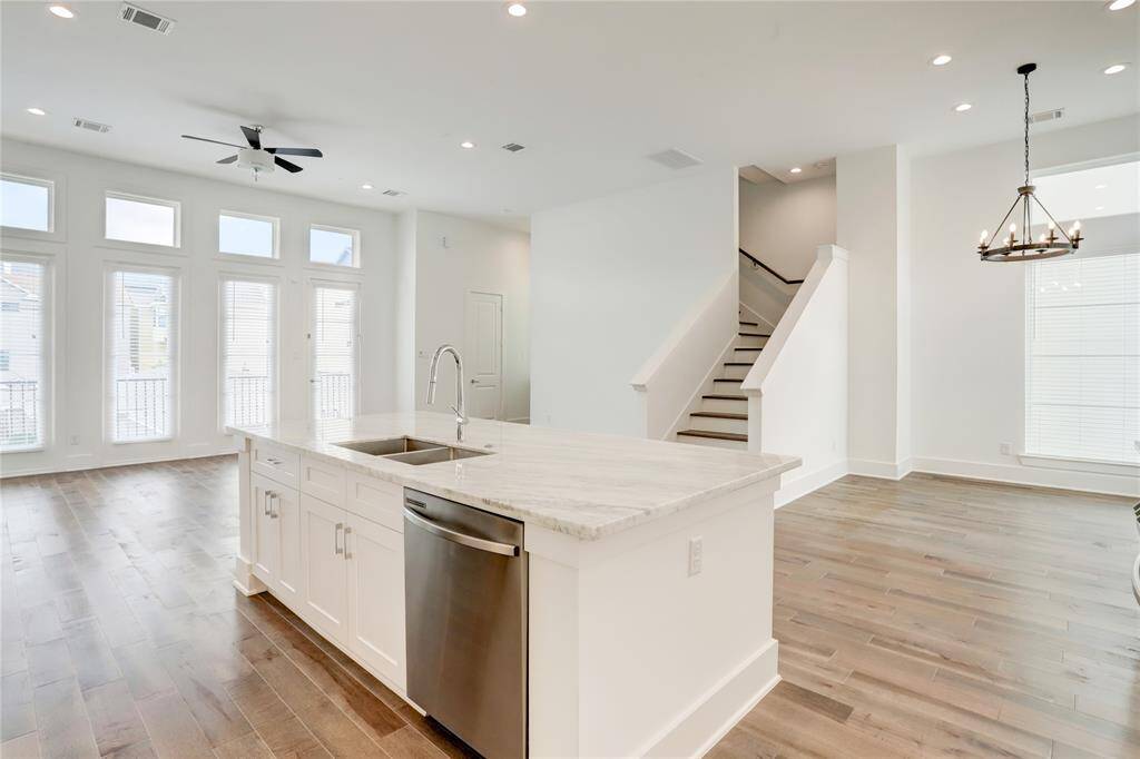 The heart of the home is this second-floor living area. Natural light flows in on all sides, and there's plenty of space for large living and dining areas. Awaiting your personal touch