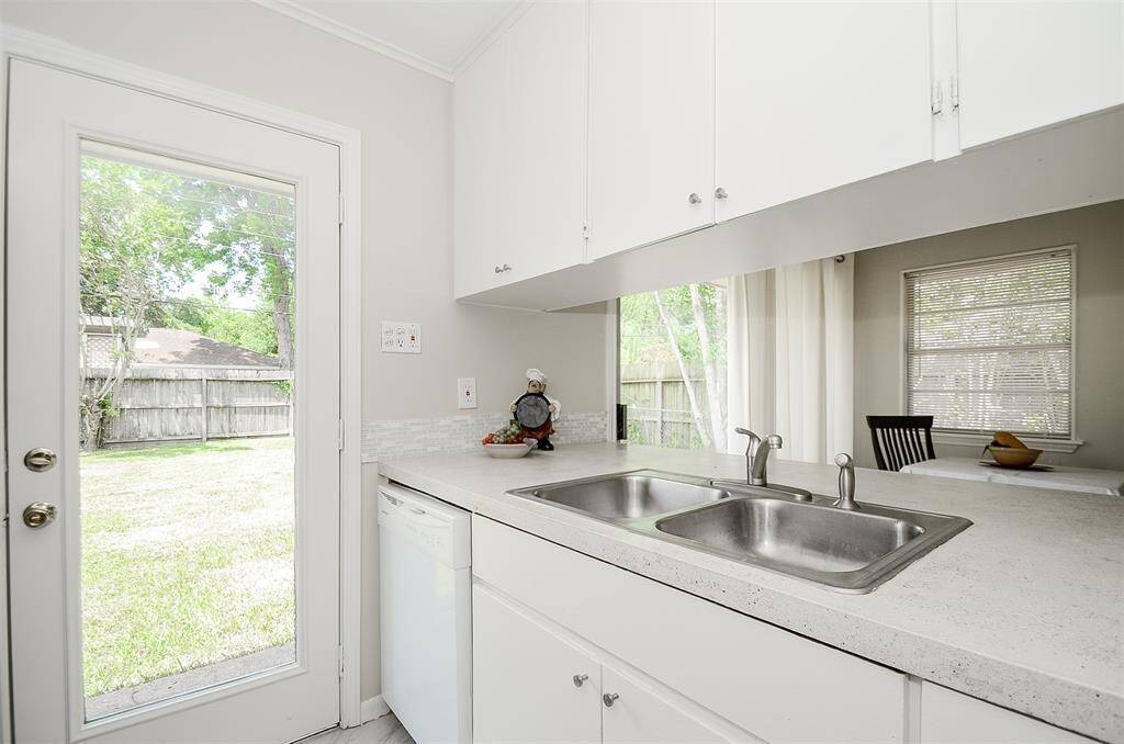 Stainless steel sink and glass to back yard.