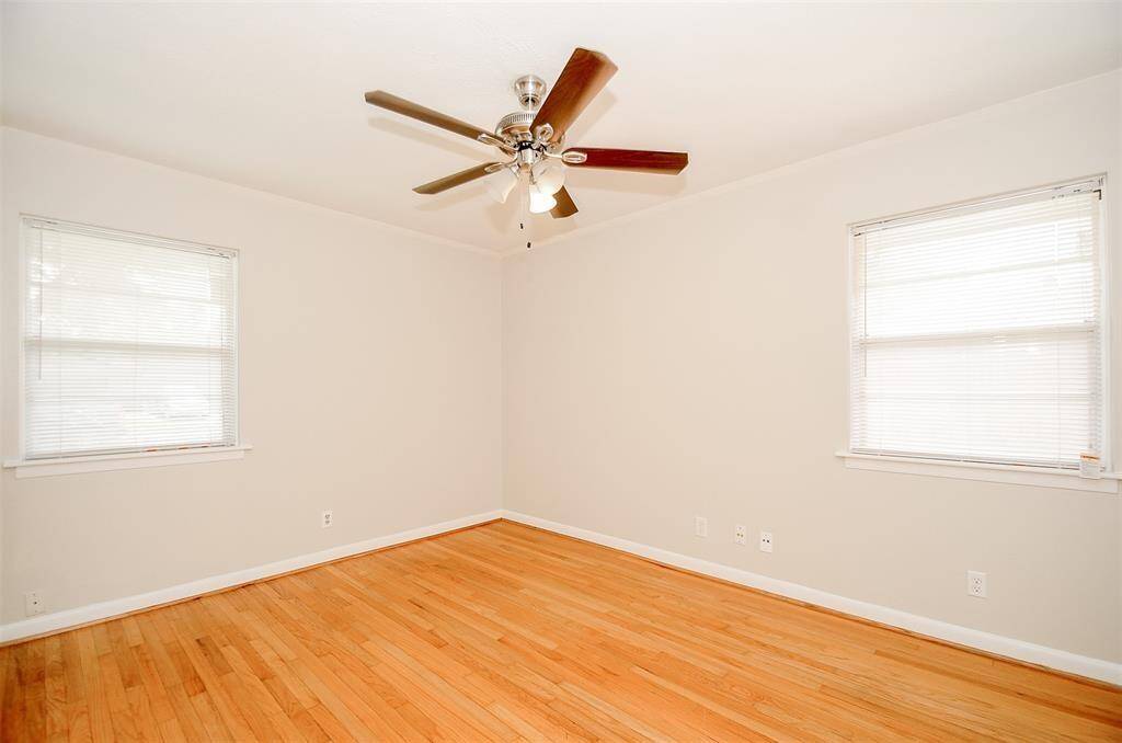 Primary bedroom with ceiling fan