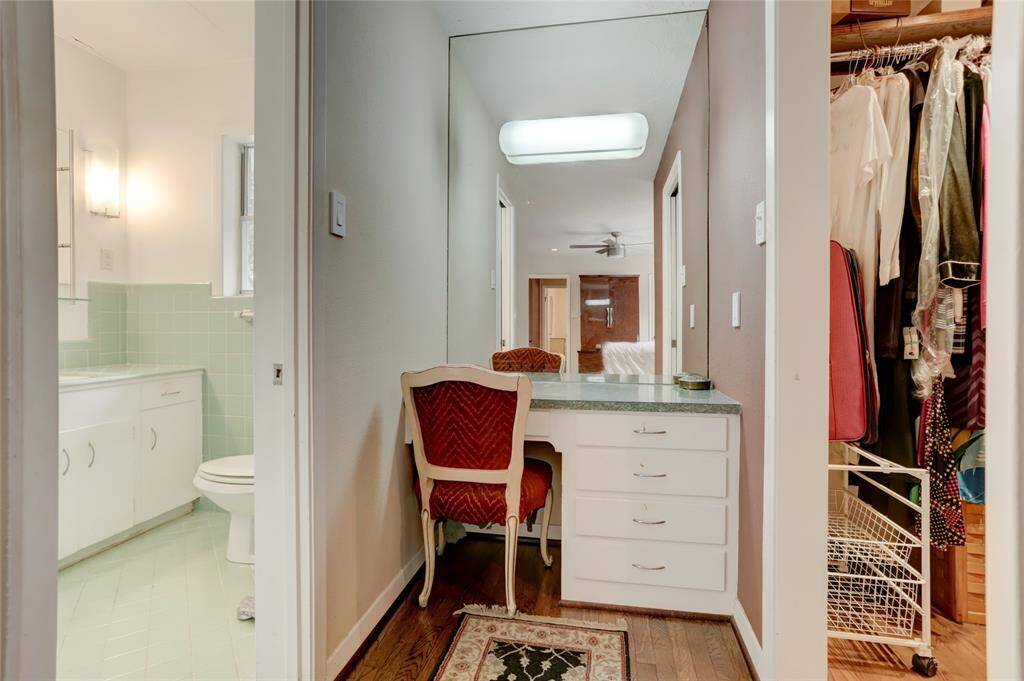 Sit down, make up area is flanked by the bathroom and walk-in closet.