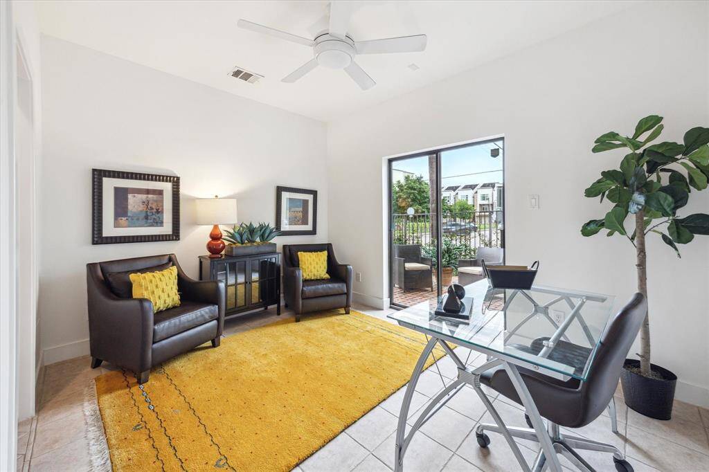 This first floor flexible bedroom easily doubles as a home office or guest suite with access to a full bath. The doors lead to the delightful fenced in patio.
