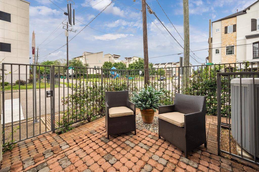 The downstairs brick-paved patio is an inviting space for relaxing.