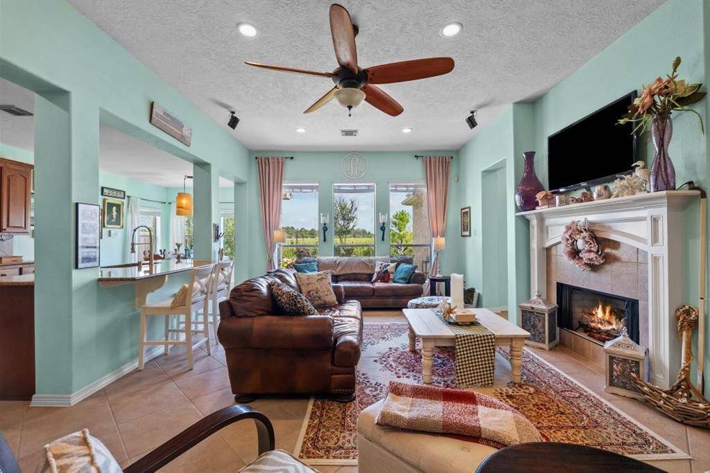 Bright and open living room with views looking into the backyard makes this a great space to enjoy spending time with family