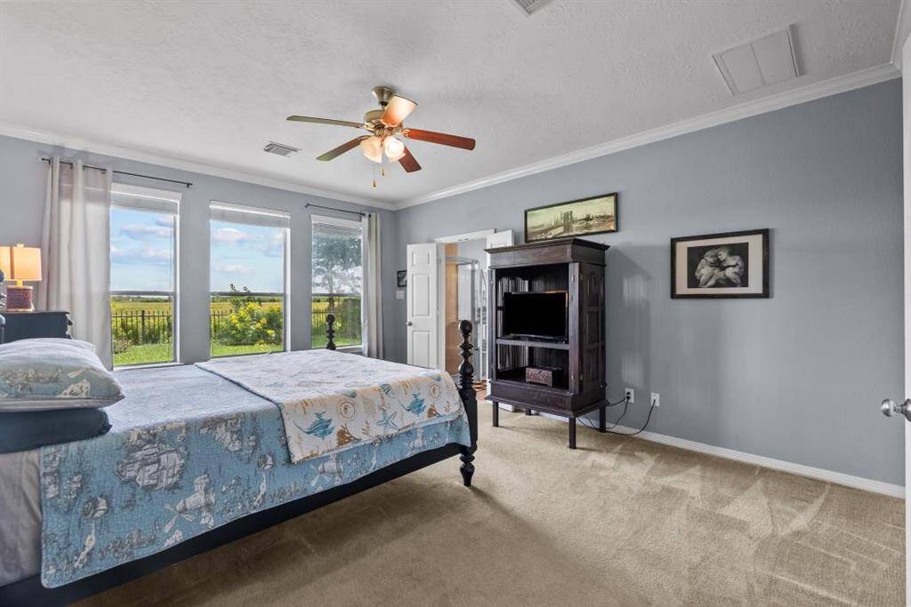 Primary suite with plenty of room for large furniture pieces.