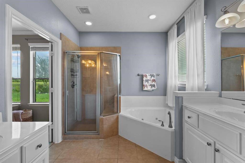 JACUZZI TUB WITH HIS AND HER SINKS