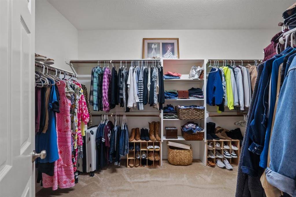 FANTASTIC WALK IN CLOSET WITH GREAT SPACE AND PLENTY OF STORAGE