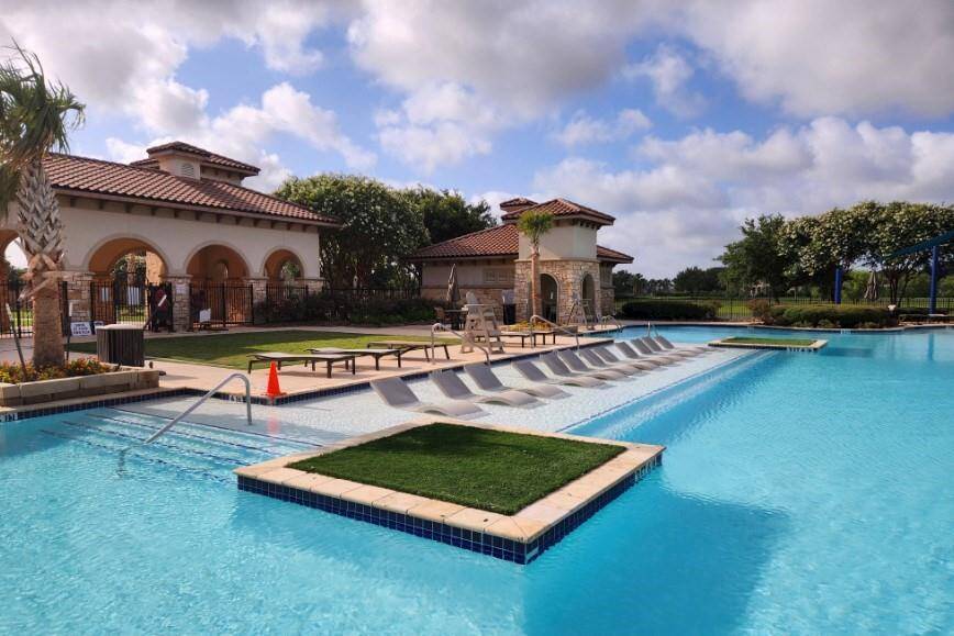 Resort style community pool overlooking one of the lakes !