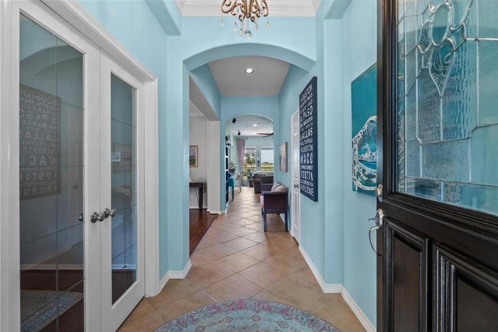 AS YOU ENTER THE FOYER YOU WILL IMMEDIATLEY SEE HOW BRIGHT AND AIRY THE HOME IS WITH TASTEFUL PAINT COLORS, AND DECOR