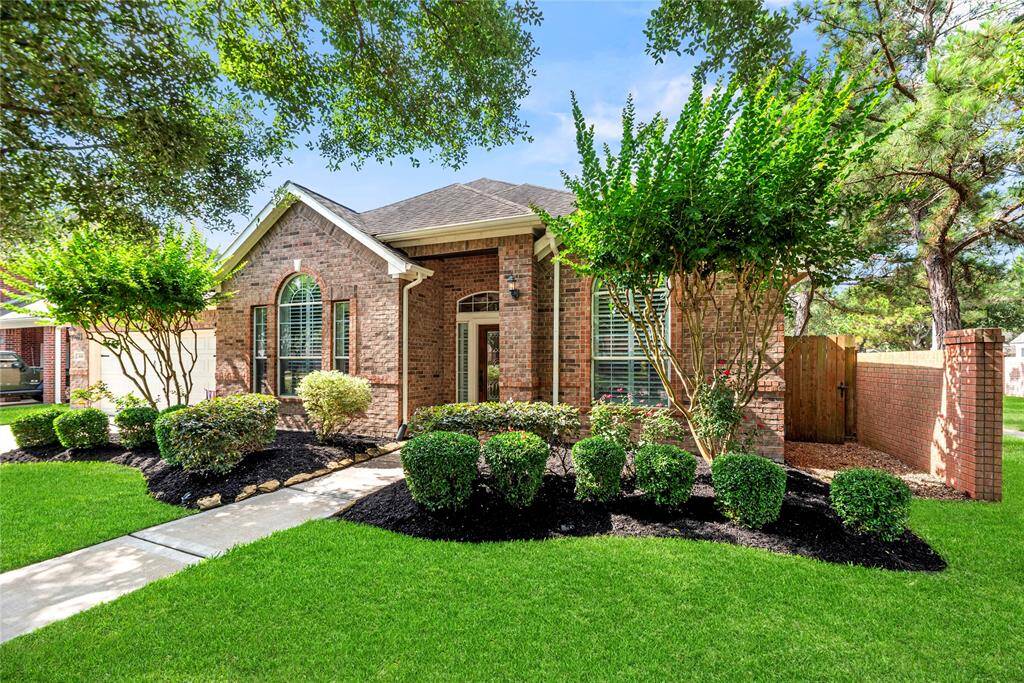 Mature trees, professional landscaping and striking curb appeal combine to create a welcoming atmosphere.
