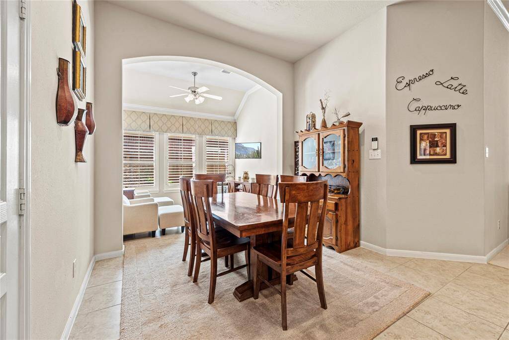 The cozy breakfast area flows seamlessly into a charming sitting room just behind—perfect for enjoying morning coffee, casual conversations, or quiet moments throughout the day.