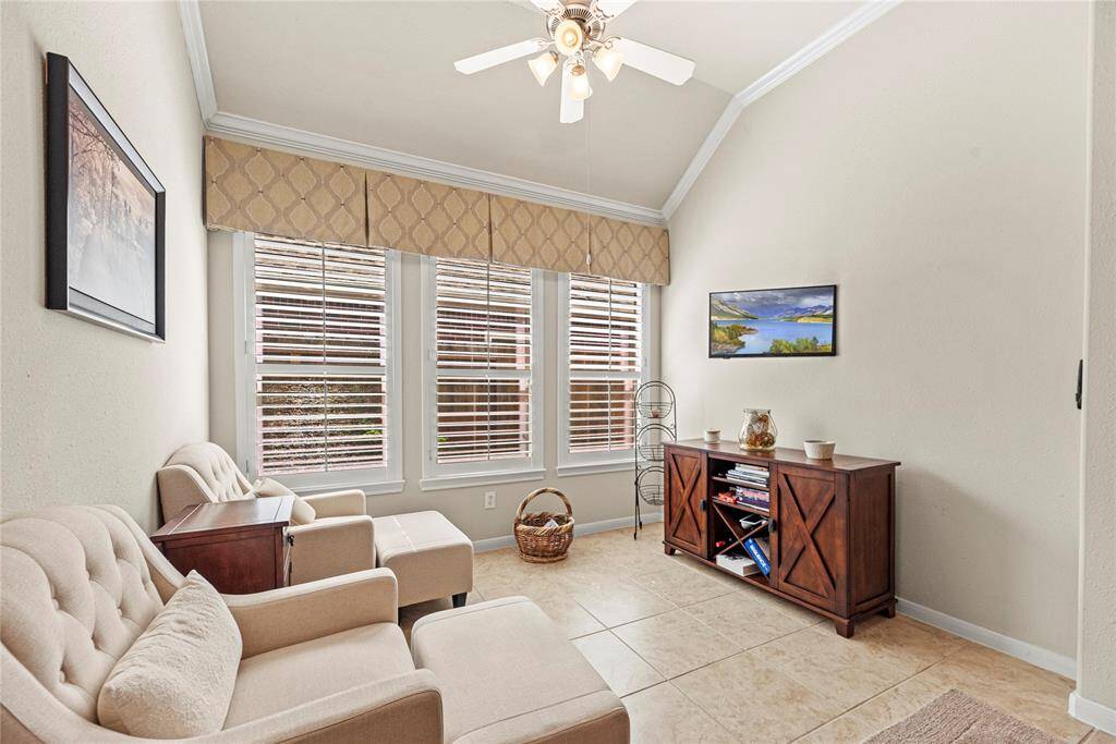 The sitting room is bathed in natural light, creating a warm and welcoming space that's perfect for relaxing or unwinding with a good book.