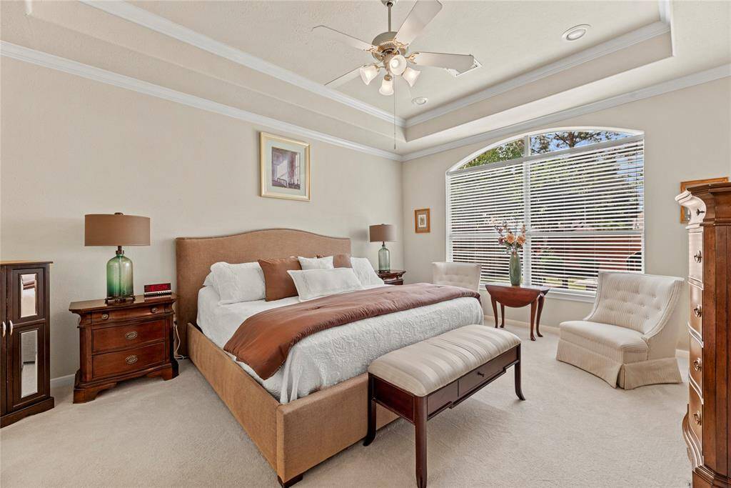 How perfect is this primary suite? Spacious and filled with natural light, this serene retreat offers the ultimate escape, promising comfort, tranquility, and pure relaxation.
