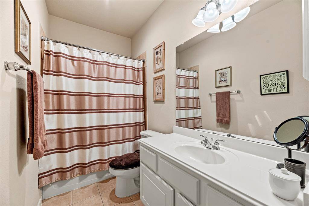 The secondary bathroom is stylishly appointed and thoughtfully designed for comfort and convenience.