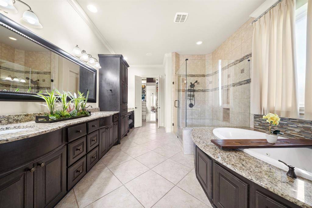 This Primary Bath is equipped with a relaxing Soaking Tub and Separate Shower!