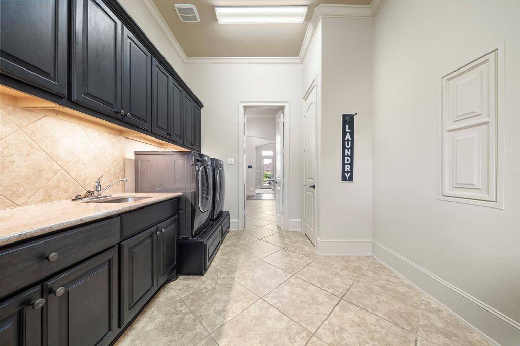 Lots of Cabinet Space and a Sink in the Laundry Room!