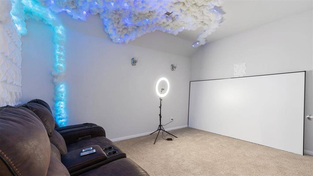Media room or optional 5th bedroom (projector can be included in sale)