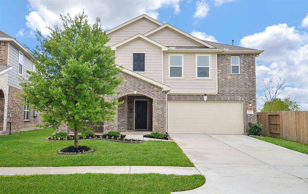 Spacious backyard with well-maintained lawn, wooden fence for privacy, ideal for families and outdoor activities.