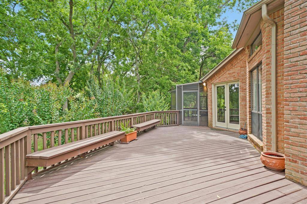 This outdoor oasis is accessible from the Breakfast Room, Living Room, Dining Room, AND Primary Bedroom.