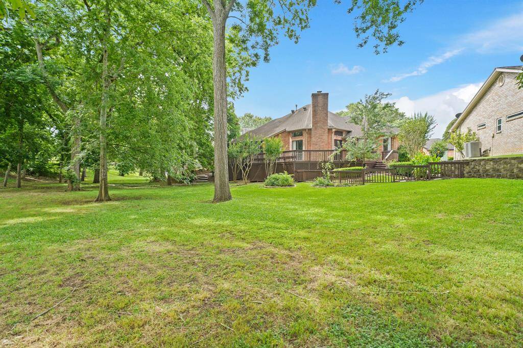 A fenced Side Yard provides a perfect place for dogs to roam or young children to play safely.