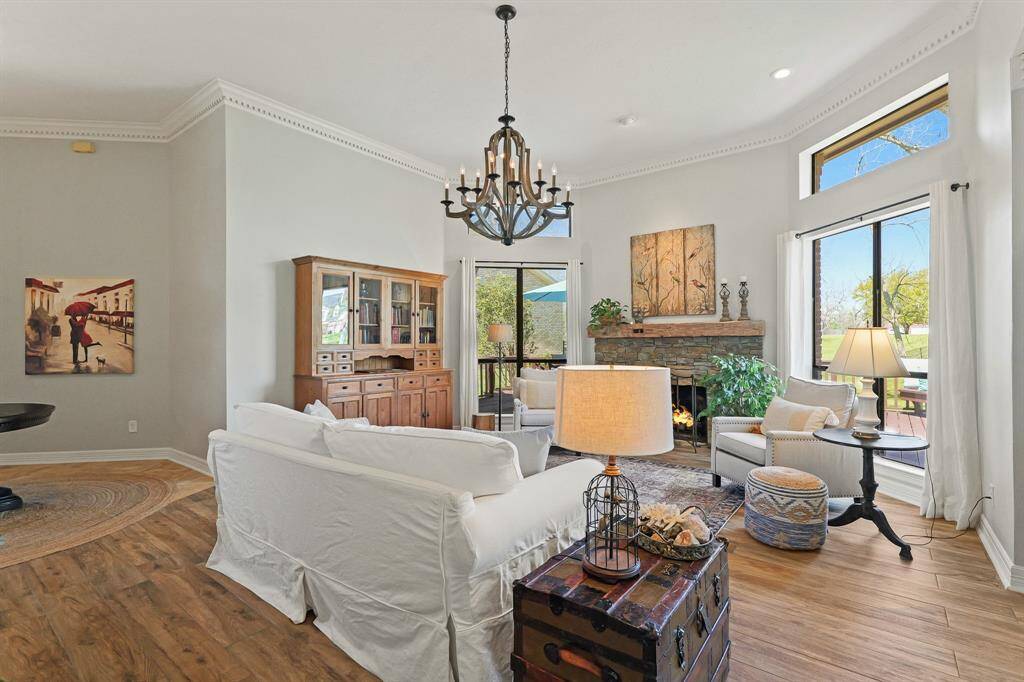 The pair of large windows, with transoms above, allows natural light to spill into the Living Room, adding welcomed warmth to the space.